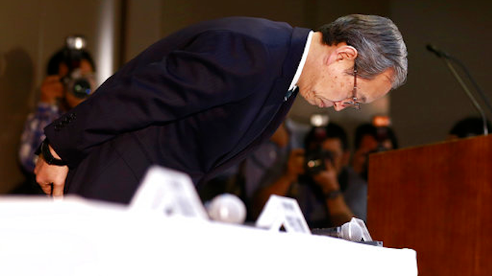 Toshiba Corp. President Satoshi Tsunakawa bows during a press conference at the company's headquarters in Tokyo, Wednesday, March 29, 2017. Japan's embattled Toshiba said Wednesday that its U.S. nuclear unit Westinghouse Electric Co. has filed for bankruptcy protection. Toshiba said in a statement that it filed the chapter 11 petition in the U.S. Bankruptcy Court of New York.