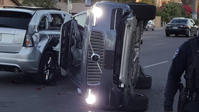 A self-driving Uber SUV rolled onto it’s side after a collision in Tempe, AZ.