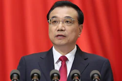 In this photo released by Xinhua News Agency, Chinese Premier Li Keqiang delivers a work report during the opening session of the annual National People's Congress at Beijing's Great Hall of the People, Sunday, March 5, 2017.