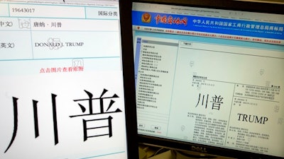 Computer screens showing some of the Trump trademarks approved by China's Trademark office and seen on their website in Beijing, China, Wednesday, March 8, 2017. China has granted preliminary approval for 38 new Trump trademarks, fueling conflict of interest concerns and questions about whether President Donald Trump is receiving special treatment from the Chinese government.