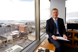 In this Feb. 16, 2017, file photo, Everett Mayor Ray Stephanson sits in his corner office overlooking downtown Everett, Wash. Stephanson is suing pharmaceutical giant Purdue Pharma, becoming the first city to try to hold the maker of OxyContin accountable for damages to his community. Connecticut-based Purdue Pharma argued in court documents filed Monday, March 20, 2017, there is no legal basis for such a lawsuit.