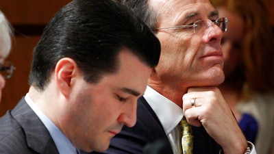 In this June 11, 2009 file photo, Dr. Scott Gottlieb, left, is seen on Capitol Hill in Washington. A White House official says President Donald Trump is choosing Gottlieb, a conservative doctor-turned-pundit with deep ties to Wall Street and the pharmaceutical industry to lead the powerful Food and Drug Administration (FDA).