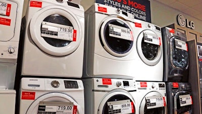 In this Wednesday, Feb. 8, 2017, photo, washers and dryers appear on display for sale at a J.C. Penney store in Pittsburgh. On Friday, March 24, 2017, the Commerce Department releases its February report on durable goods.