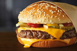 This image provided by McDonald’s Corporation shows a Quarter Pounder burger. McDonald's says it will swap frozen beef patties for fresh ones in its Quarter Pounder burgers by sometime in 2018 at most of its U.S. locations. Employees will cook up the never-frozen beef on a grill when ordered.
