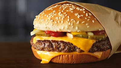 This image provided by McDonald’s Corporation shows a Quarter Pounder burger. McDonald's says it will swap frozen beef patties for fresh ones in its Quarter Pounder burgers by sometime in 2018 at most of its U.S. locations. Employees will cook up the never-frozen beef on a grill when ordered.