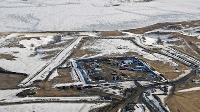 This Feb. 13, 2017, aerial file photo, shows a site where the final phase of the Dakota Access pipeline is taking place with boring equipment routing the pipeline underground and across Lake Oahe to connect with the existing pipeline in Emmons County near Cannon Ball, N.D. Federal Judge James Boasberg on Tuesday, March 14 denied a request by the Standing Rock and Cheyenne River Sioux to stop oil from flowing while they appeal his earlier decision allowing pipeline construction to finish.