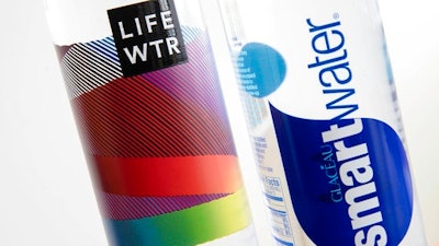 In this Thursday, March 16, 2017, photo, bottles of Lifewtr and Smartwater are displayed in Philadelphia. As bottled water surges in popularity, Coke, Pepsi and other companies are using celebrity endorsements, stylish packaging and fancy filtration processes like “reverse osmosis” to sell people on expanding variations of what comes out of the tap. They’re also adding flourishes like bubbles, flavors or sweeteners that can blur the lines between what is water and what is soda.