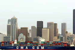 In this Monday, Feb. 29, 2016, photo, the CMA CGM Benjamin Franklin is towed to Seattle's Terminal 18. The vessel is 1,300 feet long, 177 feet wide, 197 feet high and can carry up to 18,000 containers. On Tuesday, March 7, 2017, the Commerce Department reports on the U.S. trade deficit for January.