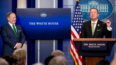 Budget Director Mick Mulvaney, joined by White House press secretary Sean Spicer, left, speaks about President Donald Trump's budget proposal for the coming fiscal year during daily press briefing at the White House, in Washington, Thursday, March 16, 2017.