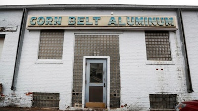 This Jan. 17, 2017, photo, shows the front entrance of Corn Belt Aluminum in Des Moines, Iowa. Manufacturing businesses across the country are getting pushed out of neighborhoods where they have operated for decades as cities remake gritty industrial districts into trendy hotspots.