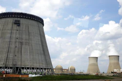 In this Friday, June 13, 2014, file photo, a new cooling tower for a nuclear power plant reactor that's under construction stands near the two operating reactors at Plant Vogtle power plant in Waynesboro, Ga. Westinghouse Electric Co., the U.S. nuclear unit of Japan’s Toshiba Corp., filed for bankruptcy protection Wednesday, March 29, 2017, calling into question the future of a number of billion-dollar nuclear projects under construction, including two in the U.S.