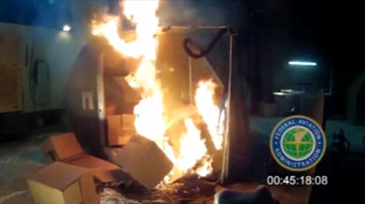 In this April 2014 file image frame grab from video, provided by the Federal Aviation Administration (FAA), a test at the FAAs technical center in Atlantic City, N.J. The International Civil Aviation Organization, a U.N. agency that sets global aviation safety standards, decided last year to ban shipments of lithium ion batteries on international passenger flights and require that the batteries be no more than 30 percent charged on cargo flights. As a result, countries around the world have been adopting the new international safety standard for their domestic flights as well. The United States is a notable exception.