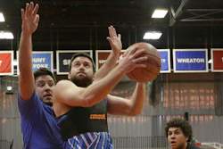 Jeremias Engelmann takes the ball to the hoop while wearing a Catapult monitoring system compression vest in a basketball game Friday, March 3, 2017, in Cambridge, Mass. Athlete trackers are being used by hundreds of teams in dozens of sports helping coaches plan their practices, make substitutions in games and decide when a player is ready to return from an injury by accumulating biometric and positioning data collected from the trackers.