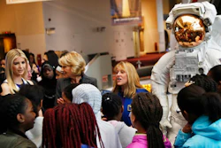 Ivanka Trump, left, Education Secretary Betsy DeVos, center, listens as NASA Astronaut Kay Hire speaks to female students at the Smithsonian's National Air and Space Museum in Washington, Tuesday, March 28, 2017, to celebrate Women's History Month.