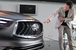 In this Feb. 27, 2017 photo, Nissan's design chief Alfonso Albaisa speaks with an Infiniti Prototype during an interview at the Nissan Technical Center in Atsugi, near Tokyo. Albaisa draws upon the cultures of Japan, America and Cuba in concocting car designs with a flair that once was lacking at Japanese automakers, critics say, but is becoming evident as they globalize.
