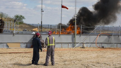 The Flame Refluxer prototype is tested in the burn pan at the Joint Maritime Test Facility in Mobile, Ala., part of tests conducted between March 13-17, 2007.