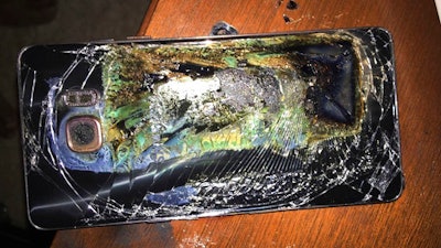 This Sunday, Oct. 9, 2016, file photo shows a damaged Samsung Galaxy Note 7 on a table in Richmond, Va., after it caught fire earlier in the day.