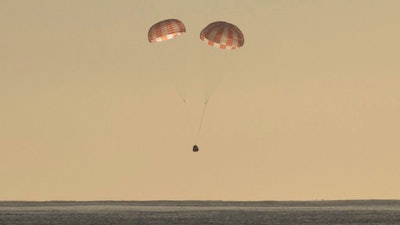 In this photo provided by SpaceX, the Dragon cargo ship parachutes into the Pacific off the Southern California coast on Sunday, March 19, 2017. Astronauts set it free from the International Space Station about 5½ hours earlier.