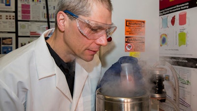 In this photo provided by the University of Minnesota, professor John Bischof works in a lab. Bischof, senior author of the study on deep-freezing donated organs, said: 'we are cautiously optimistic that we're going to be able to get into a kidney or maybe a heart. But we are not, in any way, declaring victory here.'