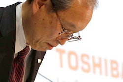 Toshiba Corp. President Satoshi Tsunakawa bows during a press conference at the company's headquarters in Tokyo, Tuesday, March 14, 2017. Troubled Japanese nuclear and electronics company Toshiba said Tuesday it was considering selling its money-losing Westinghouse operations in the U.S.