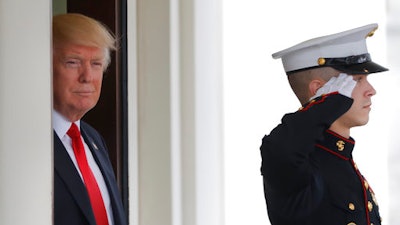 President Donald Trump awaits the arrival of Danish Prime Minister Lars Lokke Rasmussen at the White House in Washington, Thursday, March 30, 2017.