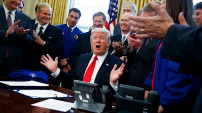 President Donald Trump speaks in the Oval Office of the White House in Washington, Tuesday, March 21, 2017, after signing a bill to increase NASA's budget to $19.5 billion and directs the agency to focus human exploration of deep space and Mars.