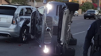 A self-driving Uber SUV rolled onto it’s side after a collision in Tempe, AZ.