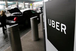 In this Wednesday, March 15, 2017 file photo, a sign marks a pick-up point for the Uber car service at LaGuardia Airport in New York. Jeff Jones, president of the embattled ride-hailing company Uber, has resigned just six months after taking the job, the company confirmed Sunday, March 19.