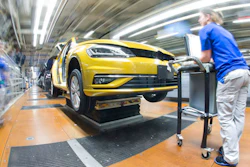 In this March 9, 2017 file photo, an employee works at the assembly line for Golf 7 cars in the Volkswagen factory in Wolfsburg, Germany. The annual news conference of Volkswagen takes place on Tuesday March 14, 2017 in Wolfsburg.