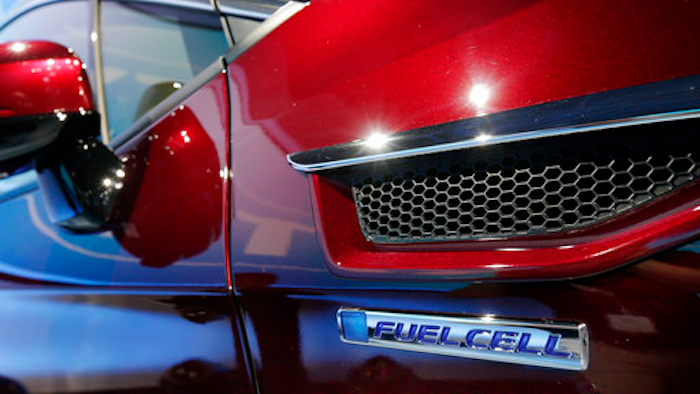 The fuel cell logo adorns the fender of the Honda Clarity at a media preview at the New York International Auto Show, at the Jacob Javits Center in New York, Wednesday, April 12, 2017.