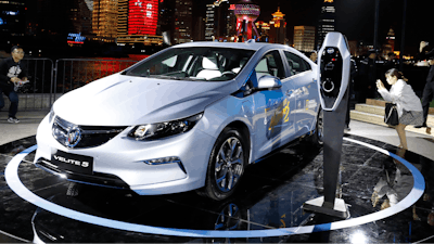 Visitors take photos of the Buick Velite 5, an extended range electric hybrid, during a global launch event ahead of the Shanghai Auto 2017 show in Shanghai, China, Tuesday, April 18, 2017. At the auto show, the global industry's biggest marketing event of the year, almost every global and Chinese auto brand is showing at least one electric concept vehicle, if not a market-ready model.