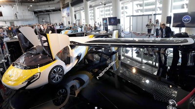 AeroMobil display their latest prototype of a flying car, in Monaco, Thursday, April 20, 2017. The light frame plane whose wings can fold back, like an insect is boosted by a rear propeller. The company says it is planning to accept first preorders for the vehicle as soon as later this year.
