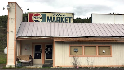 In this April 5, 2017 photo, the Tiller Market stands abandone. Tiller, a dot on a map in remote southwestern Oregon, is for sale for $3.5 million, including the market, and the elementary school is for sale separately for $350,000. A potential buyer has come forward but is remaining anonymous -- and back-up offers are still being accepted.