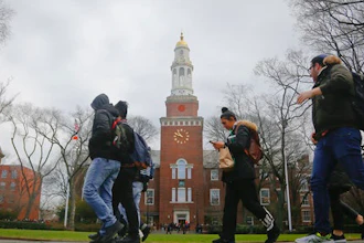 FILE - In this Feb. 1, 2017, file photo, Brooklyn College students walk between classes on campus in New York. The New York state Legislature approved a budget on April 9, 2017, that includes funding for Democratic Gov. Andrew Cuomo's plan to offer free tuition for middle class students at state universities.