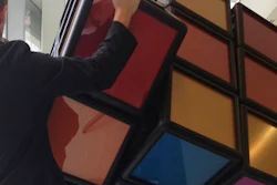 A person operates an oversized Rubik's Cube shortly after its unveiling inside the University of Michigan’s G.G. Brown engineering building in Ann Arbor, Mich., Thursday, April 13, 2017. Some of the past and present mechanical engineering students designed and built the 1,500-pound tribute to one of the world’s all-time great brain teasers.