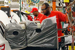 In this April 6, 2016, photograph, a technician uses a lift to move a back seat section into a new Altima on the assembly line at the Nissan Canton Vehicle Assembly Plant in Canton, Miss. U.S. industrial production posted a solid gain in March 2017, reflecting a record rebound in utility output. But a closely watched gauge of manufacturing posted its first setback in seven months as auto production dropped sharply.