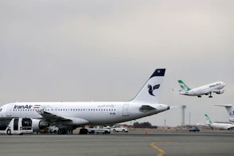 In this Feb. 7, 2016, file photo, an Iranian Mahan Air passenger plane takes off as a plane of Iran's national air carrier Iran Air, left, is parked at Mehrabad airport in Tehran, Iran. European airplane manufacturer ATR said it signed a deal with Iran Air for 20 aircraft with option for 20 more on Thursday, April 13, 2017.