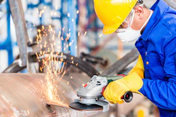 Metal Worker In Factory Grinding Metal Of Pipeline 000058892894 Xxx Large 590202e5df94e