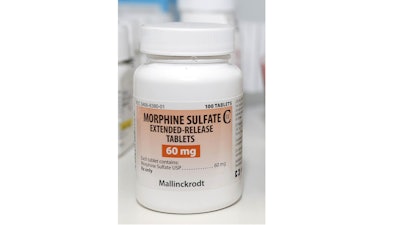 This photo shows a bottle of Morphine Sulfate, made by the pharmaceutical company Mallinckrodt PLC, in Carmichael, Calif. The Dublin, Ireland-based company, which sells a number of powerful opioid painkillers, has agreed to pay the U.S. government $35 million to resolve a probe of its distribution of those drugs.