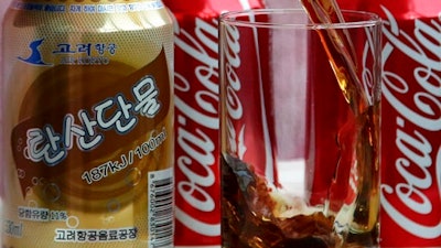In this Tuesday, April 11, 2017, photo, a can of Air Koryo cola, produced by Air Koryo, the country's flagship airline which recently introduced its own brand of cola on flights to and from Beijing is seen in Pyongyang, North Korea. Coca Cola is possibly the world's most recognizable brand, an almost inescapable symbol of the global appeal of American-style consumer culture. There are only two countries in the world where Coke doesn't officially operate, and one of them is North Korea.