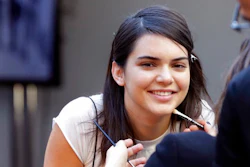 In this Wednesday, Sept. 14, 2016, file photo, model Kendall Jenner has makeup applied backstage before the Michael Kors Spring 2017 collection is modeled during Fashion Week, in New York. Pepsi is not saying whether it will continue to run an ad, featuring Jenner, that is being widely criticized and mocked on social media for appearing to trivialize protests for social justice causes.