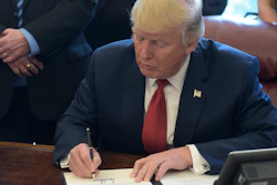 President Donald Trump signs an executive memorandum on investigation of steel imports, Thursday, April 20, 2017, in the Oval Office of the White House in Washington.