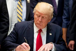 President Donald Trump signs the Education Federalism Executive Order during a federalism event with governors in the Roosevelt Room of the White House in Washington, Wednesday, April 26, 2017.