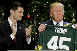 In this Dec. 13, 2016, file photo, President-elect Donald Trump holds up Green Bay Packers jersey given to him by House Speaker Paul Ryan at a rally in West Allis, Wis. President Donald Trump heads to Ryan's congressional district in Wisconsin on Tuesday, April 18, 2017, facing low approval ratings and in the wake of his failure to fulfill a campaign promise to repeal and replace the federal health care law.