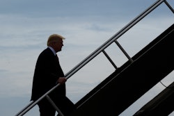 President Donald Trump walks up the steps of Air Force One at General Mitchell International Airport in Milwaukee, Tuesday, April 18, 2017. Trump went to Kenosha, Wis., to visit the headquarters of tool manufacturer Snap-on Inc., and sign an executive order that seeks to make changes to a visa program that brings in high-skilled workers.