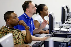 In this Friday, March 10, 2017, file photo, job seekers look at their respective computer screens during a resume writing class at the Texas Workforce Solutions office in Dallas. On Thursday, April 13, 2017, the Labor Department reported that fewer Americans sought unemployment benefits the week before, which is evidence of a stable job market and greater security for workers.