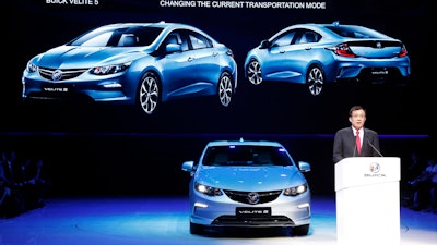 SAIC-GM president Wang Yongping announces the global launch of the Buick Velite 5, an extended range electric hybrid, during a global launch event ahead of the Shanghai Auto 2017 show in Shanghai, China, Tuesday, April 18, 2017. At the auto show, the global industry's biggest marketing event of the year, almost every global and Chinese auto brand is showing at least one electric concept vehicle, if not a market-ready model.