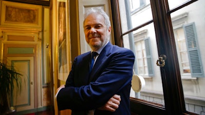 In this Tuesday, March 21, 2017, file photo, Salini-Impregilo CEO Pietro Salini poses in his office in Milan, Italy. Italian engineering and construction firm Salini Impregilo’s purchase of the U.S. company Lane Construction completed in 2016 has fundamentally shifted the company’s global orientation into a more domestic U.S. role as it seeks to grow in more stable markets.