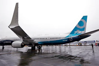 In this March 7, 2017 file photo, the first of the large Boeing 737 MAX 9 models, Boeing's newest commercial airplane, sits outside its production plant, in Renton, Wash. Boeing Co. announced Tuesday, April 4, 2017 that it has signed a new, $3 billion deal with Iran's Aseman Airlines for 30 Boeing 737 MAX aircraft. Chicago-based Boeing said the deal includes purchase rights for an additional 30 737 MAX aircraft.