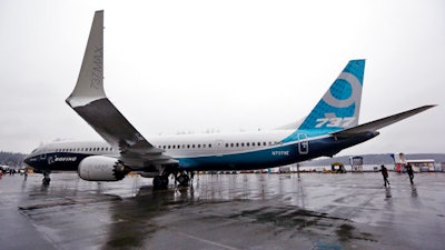 In this March 7, 2017 file photo, the first of the large Boeing 737 MAX 9 models, Boeing's newest commercial airplane, sits outside its production plant, in Renton, Wash. Boeing Co. announced Tuesday, April 4, 2017 that it has signed a new, $3 billion deal with Iran's Aseman Airlines for 30 Boeing 737 MAX aircraft. Chicago-based Boeing said the deal includes purchase rights for an additional 30 737 MAX aircraft.